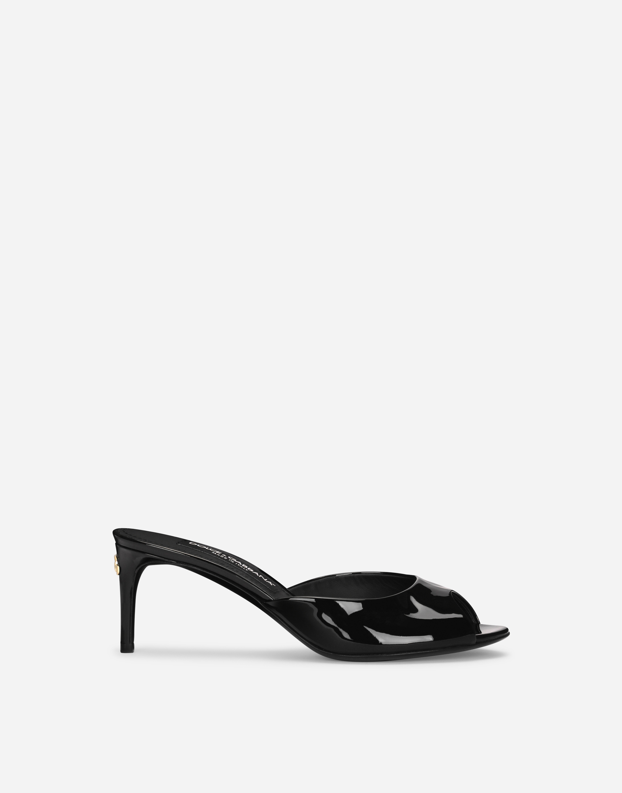 Patent leather mules in Black