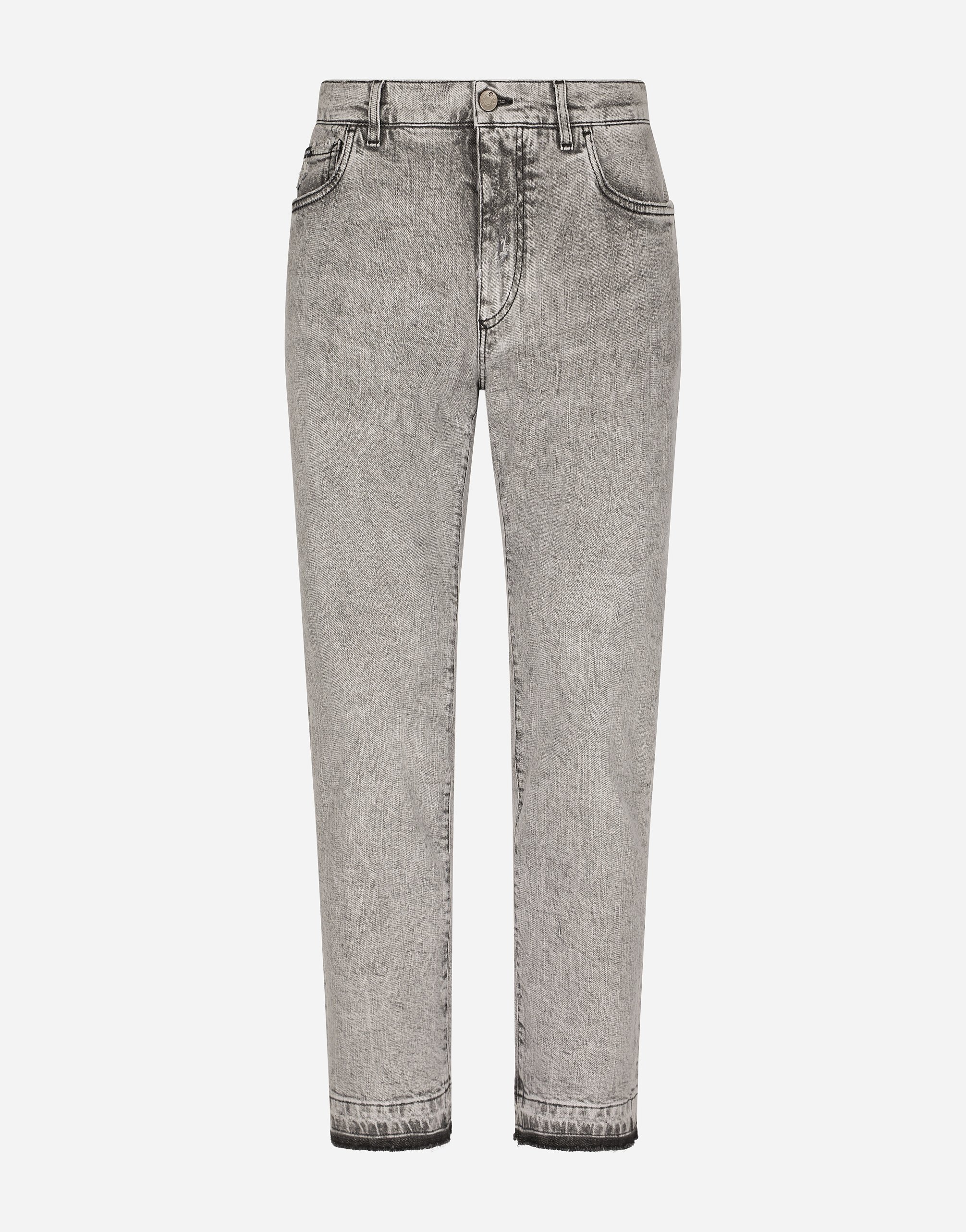 Gray skinny stretch jeans with ripped hems in grey