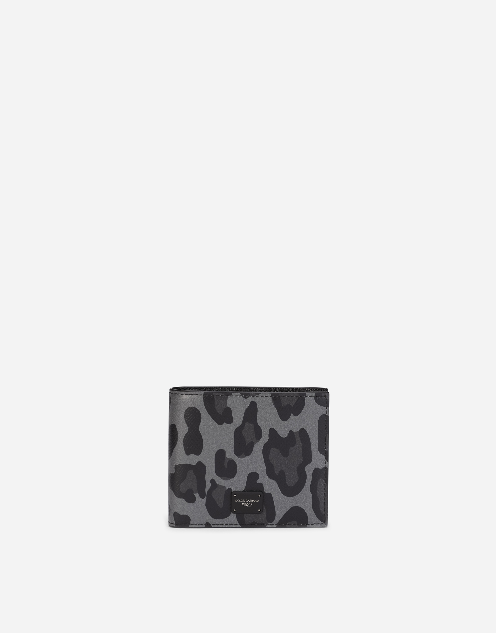 Dauphine calfskin bifold wallet with leopard print against a gray background in Multicolor