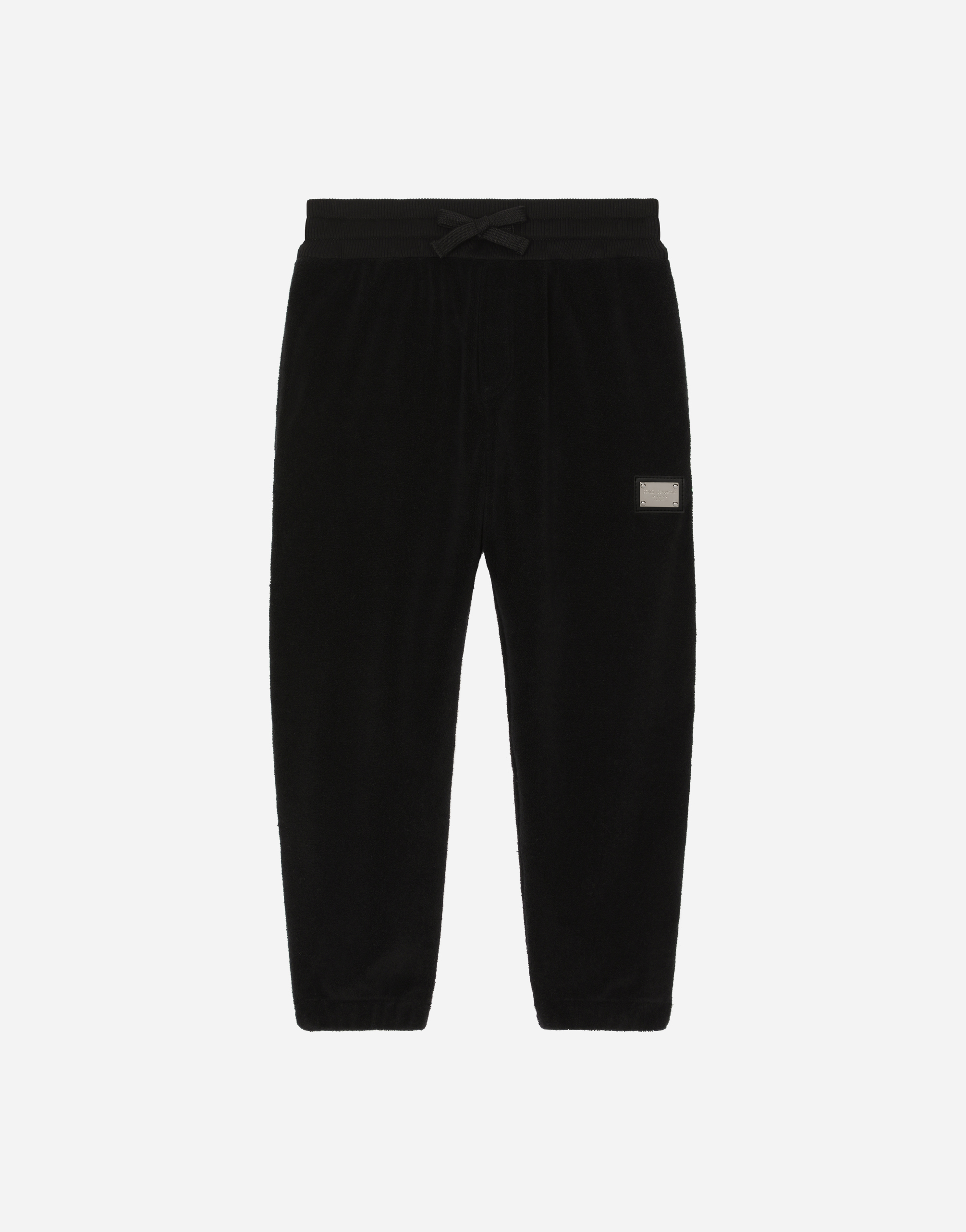 Terrycloth jogging pants with logo tag in Black