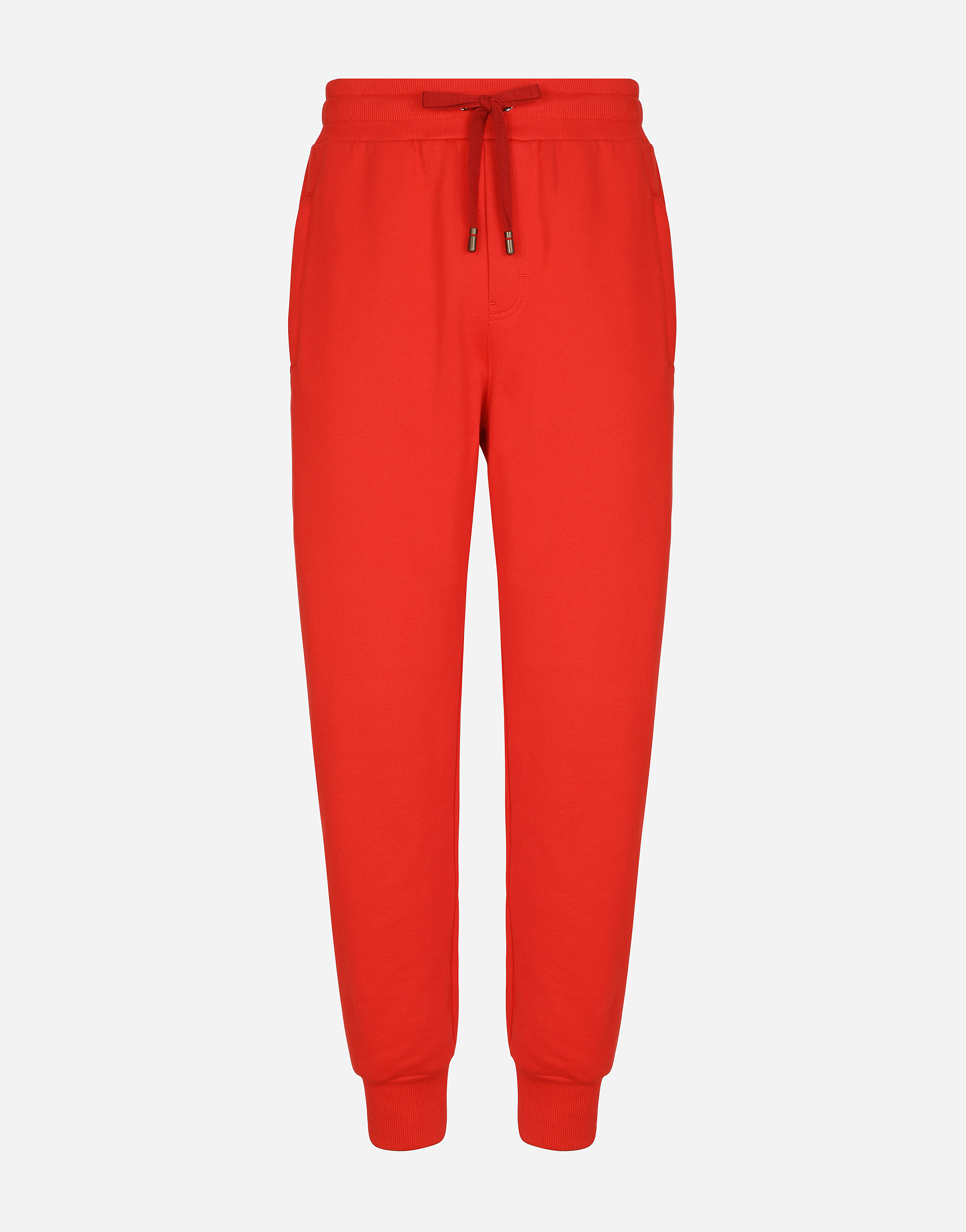 Jersey jogging pants with embossed tag in Red