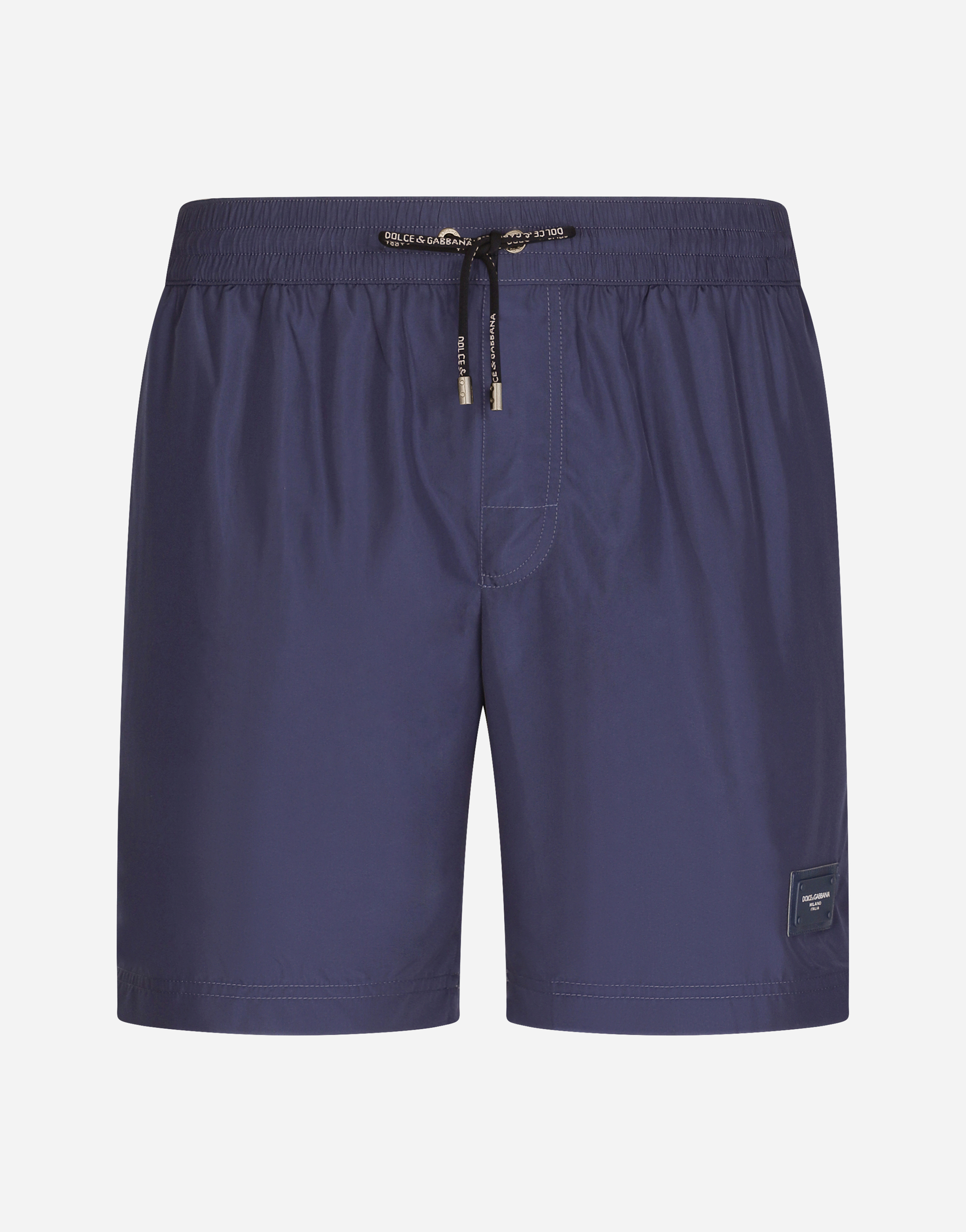 Mid-length swim trunks with branded plate in Blue