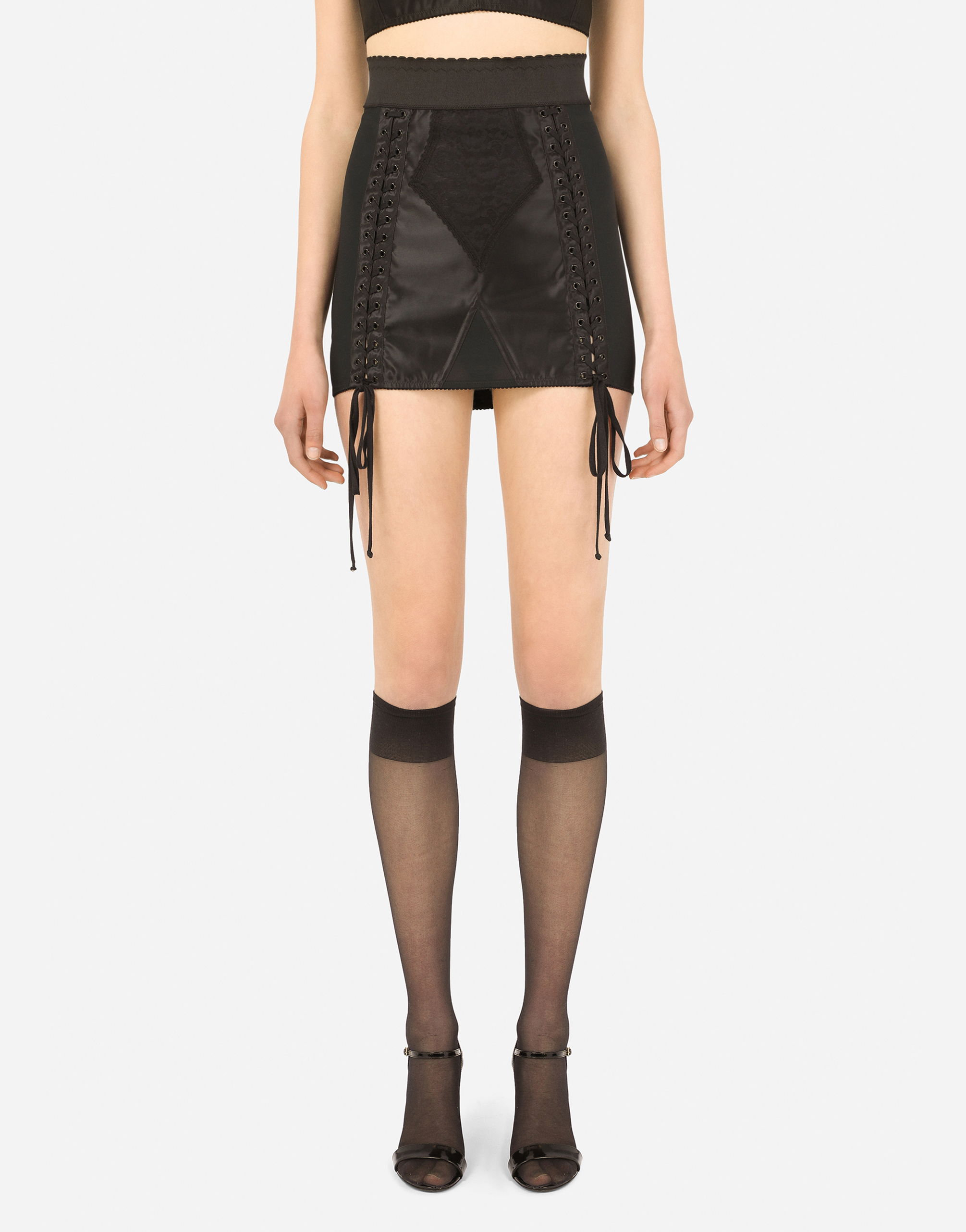 Corset-style miniskirt with laces and eyelets in Black