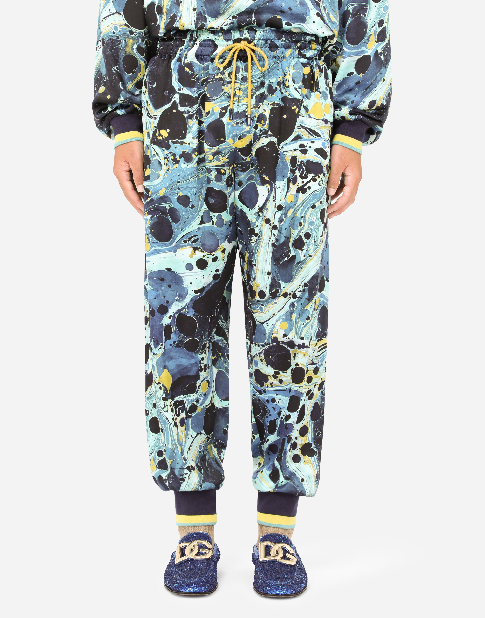 Satin jogging pants with blue marbled print in Multicolor